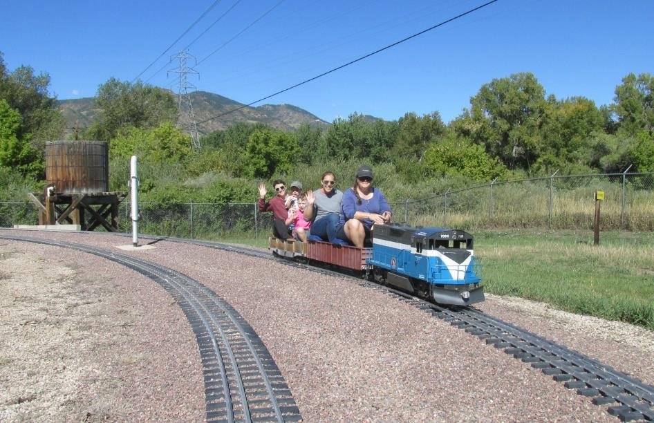 Club train with riders on the Rocky Mountain Rails main line