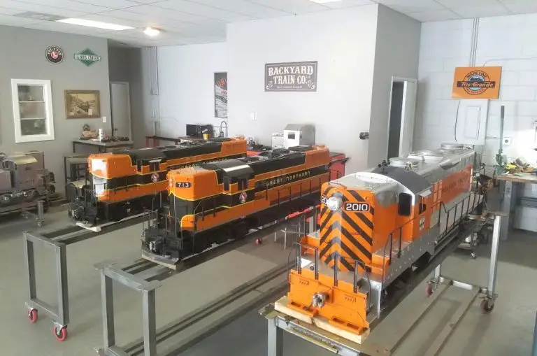 Three 7.5 inch gauge diesel locomotives lined up for delivery at Backyard Train Co.