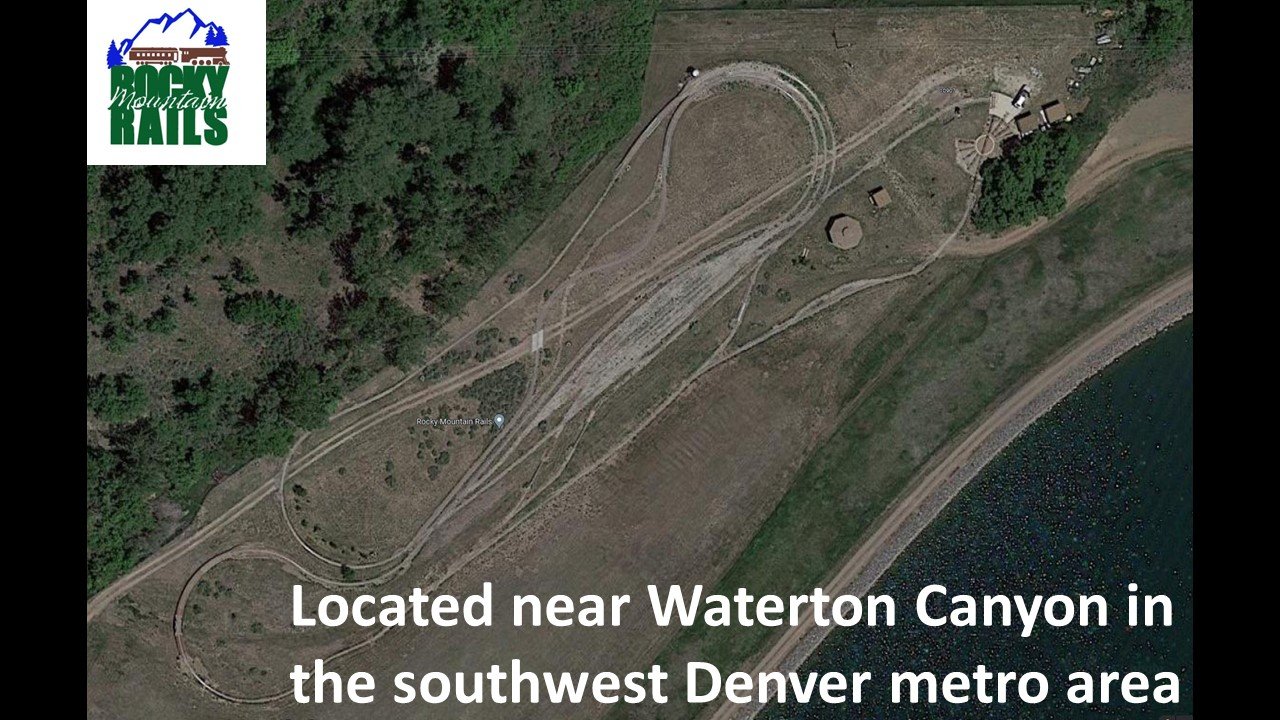 Trackside scene with visitors and locomotives